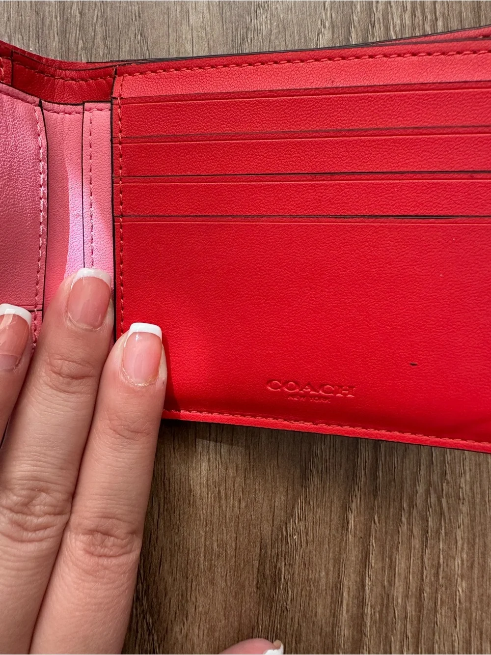 Coach Orange Signature Pattern Bifold Wallet